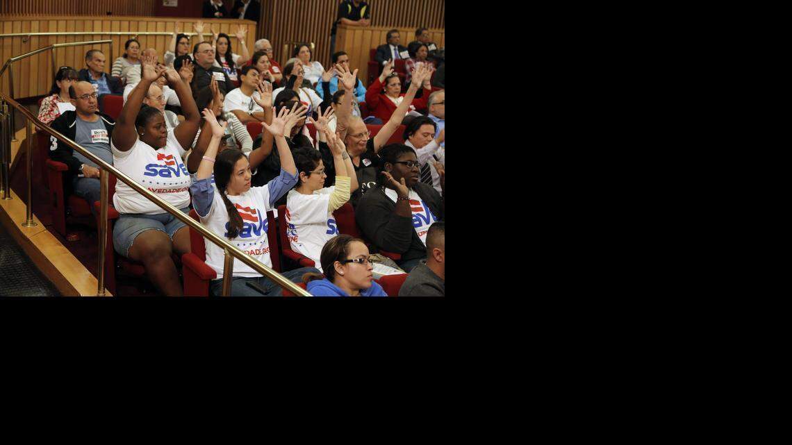 
Supporters in November raise their hands in favor of amending Miami-Dade County’s nondiscrimination law to include gender identity and expression. The ordinance passed Dec. 2. 
