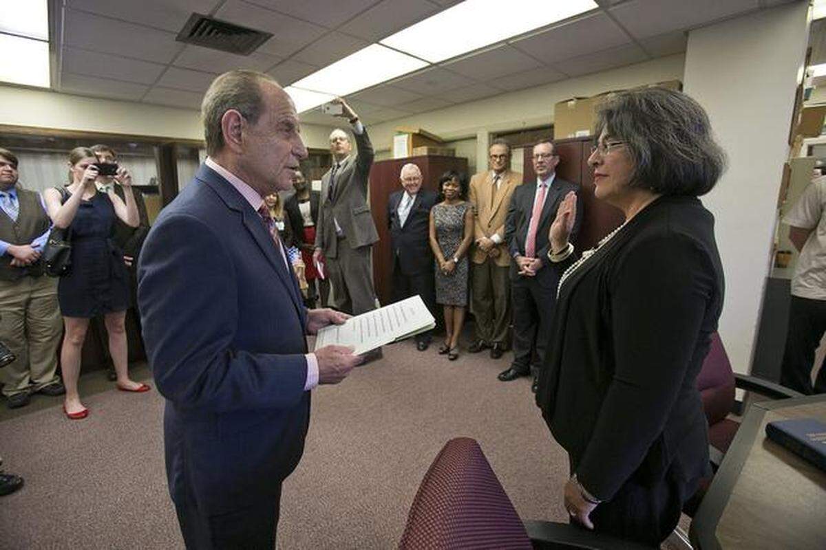 Miami-Dade County Clerk Harvey Ruvin swears in Miami-Dade Commissioner Daniella Levine Cava on Nov. 18, 2014, in this file photo. Levine Cava is now mayor of Miami-Dade.