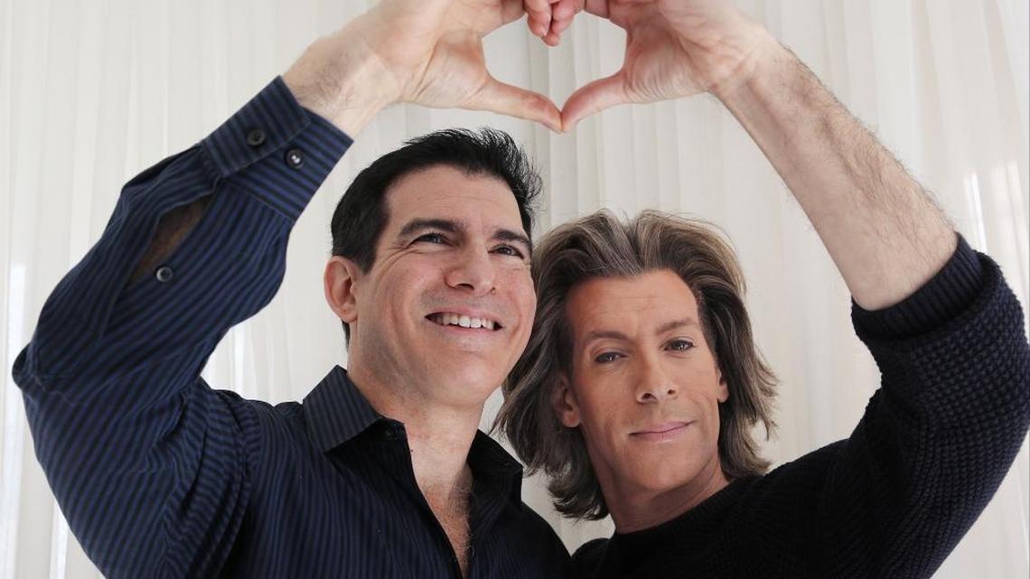 Marc Lamb, left, and Mark Nedlin, right, inside their apartment. The pair have been together for over 30 years.