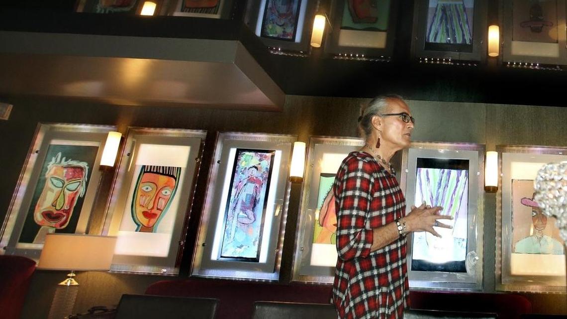 Santa Fe artist Steven Snyder stands with his paintings during the Visionary Luncheon to launch TransArt, presented by Unity Coalition and The Betsy South Beach on Thursday, June 16, 2016. TransArt features work by transgender artists. Trans Poets Workshop founder Cat Fitzpatrick, editor, author, poet and English literature teacher at Rutgers University-Newark, was the luncheon's featured speaker. Paintings by Snyder are exhibited at The Betsy South Beach hotel, 1440 Ocean Dr.