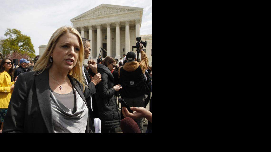 
Florida Attorney General Pam Bondi speaks to reporters in front of the Supreme Court in Washington on March 28, 2012.
