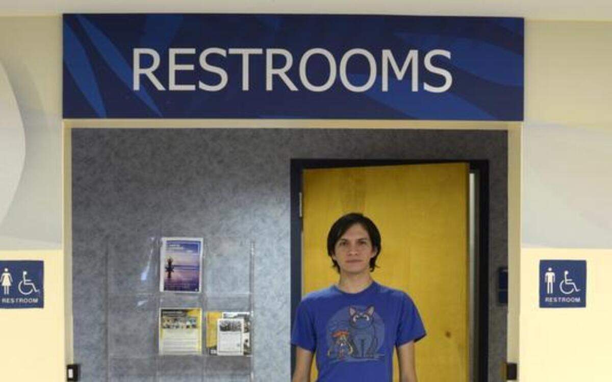 
Gaby Benavente, 20, a transgender student at Florida International University, stands in front of the bathrooms scheduled for renovations at the Graham Center, FIU’s student union. As the bathrooms are renovated in late Spring 2015, a storage closet close by will be turned into the university's first gender neutral bathroom. 
