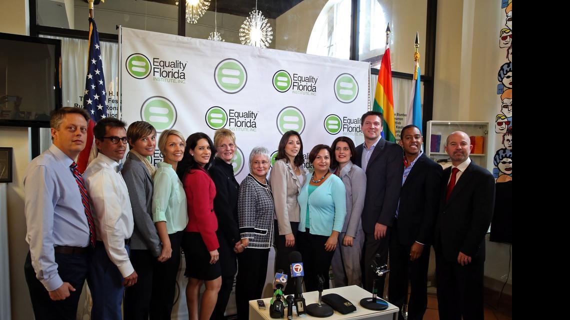 
In 2014: Same-sex partners Don Price Johnston and Jorge Isaias Diaz, Melanie and Vanessa Alenier, Pamela Faerber and Summer Greene, Catherine Pareto and Karla Arguello, attorney Elizabeth F. Schwartz, Todd and Jeff Delmay, and NCLR Legal Director Shannon Minter after a news conference announcing that the couples and Equality Florida Institute sued in Miami-Dade Circuit Court for the freedom to marry.
