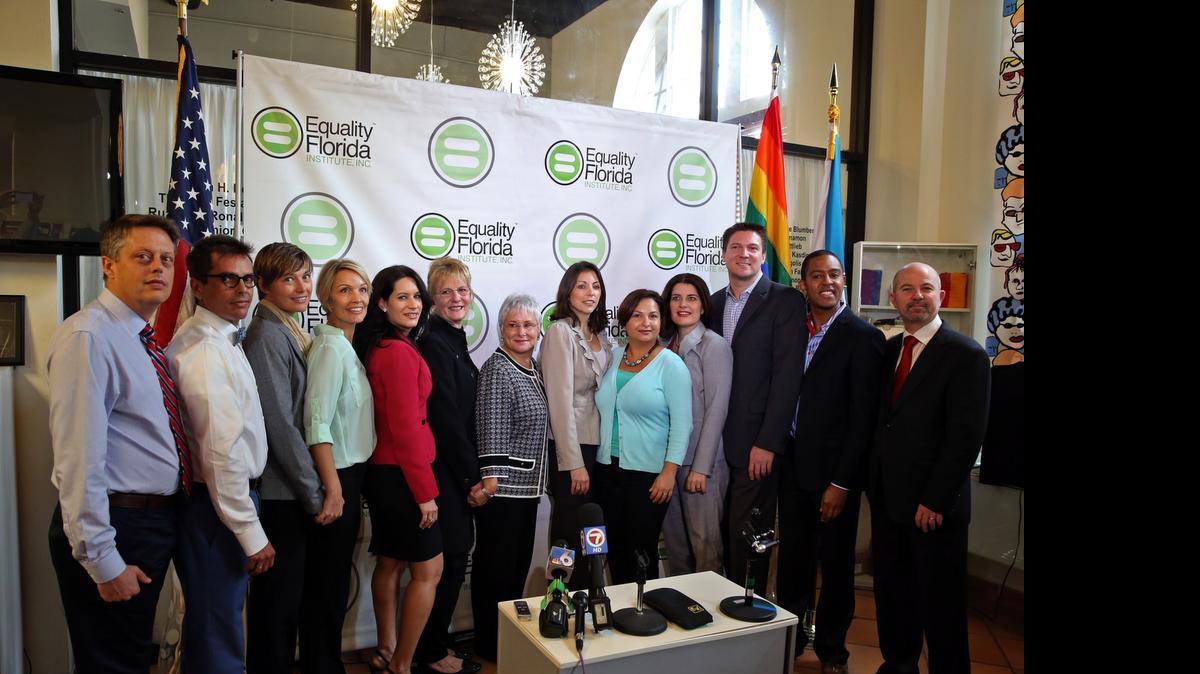 
In 2014: Same-sex partners Don Price Johnston and Jorge Isaias Diaz, Melanie and Vanessa Alenier, Pamela Faerber and Summer Greene, Catherine Pareto and Karla Arguello, attorney Elizabeth F. Schwartz, Todd and Jeff Delmay, and NCLR Legal Director Shannon Minter after a news conference announcing that the couples and Equality Florida Institute sued in Miami-Dade Circuit Court for the freedom to marry.
