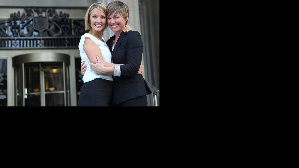 
Melanie, left, and Vanessa Alenier embrace on the steps of the Miami-Dade courthouse after Judge Sarah Zabel lift her stay on same-sex marriage and officiated civil same-sex marriages.


