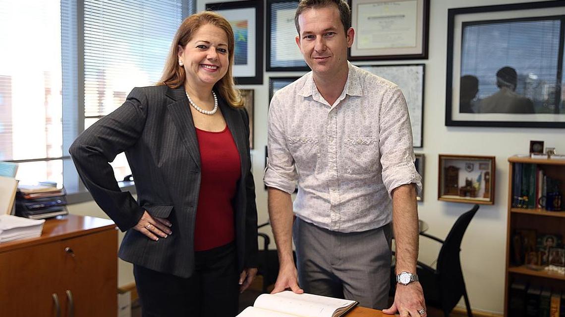 José Crespo-Cagnant, a gay Mexican immigrant meets with his lawyer Rebeca Sanchez-Roig, after they won a request for a dismissal on a deportation order and criminal charges in federal court on Dec. 14, 2015.
