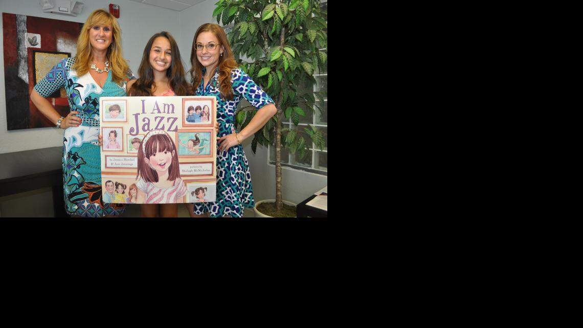 
Jazz Jennings, flanked by her mother Jeanette and Jessica Herthel, who co-wrote ‘I Am Jazz’ with the teen at a June 2014 book reading at Care Resource in Oakland Park.
