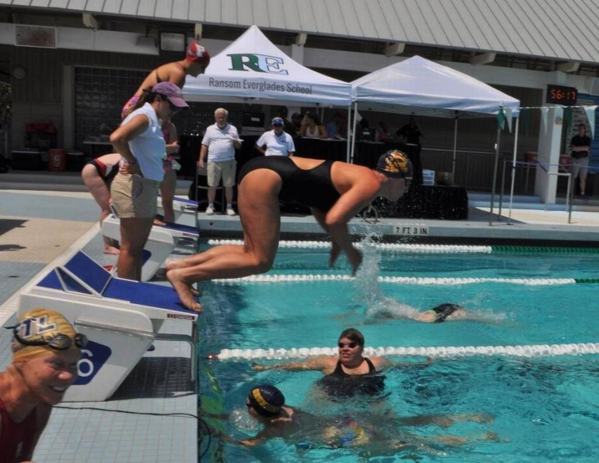 Jax Cole, 36, a World OutGames Miami competitor from Long Beach, California, dives into the pool during one of the few events that wasn’t canceled.