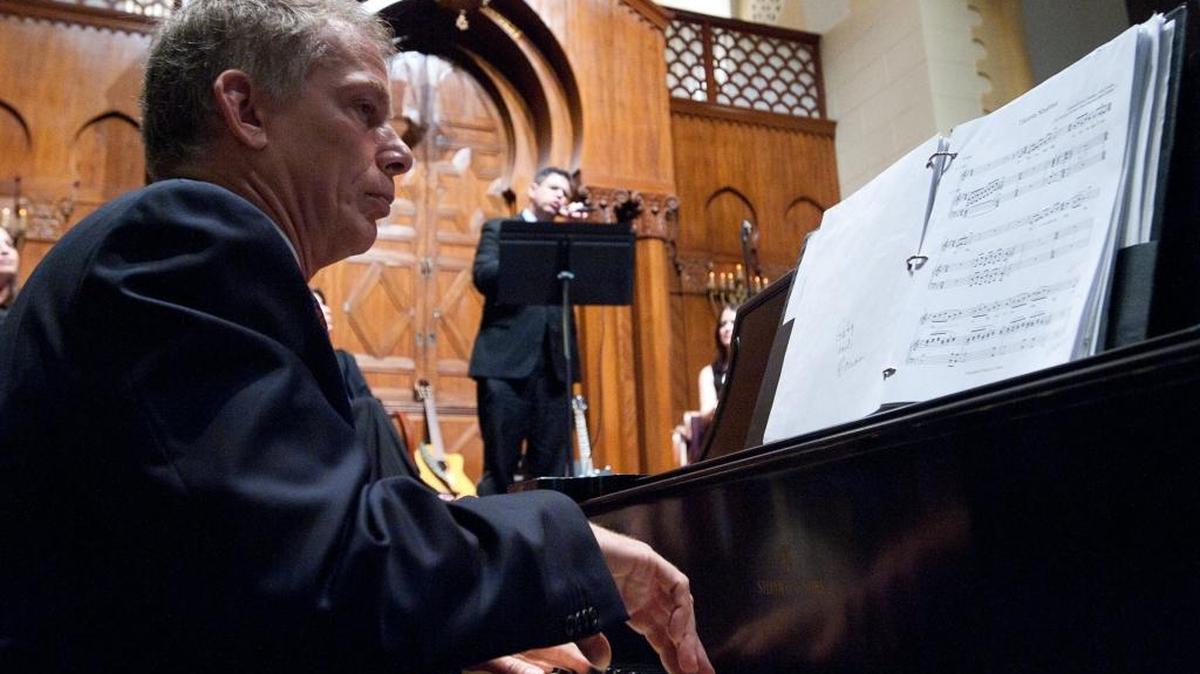 Alan Mason, music director at Temple Israel of Greater Miami, left, accompanies Steven Hevenstone of B'nai Torah Congregation in Boca Raton during the Winter Jewish Music Concert at Temple Israel of Greater Miami in 2012.