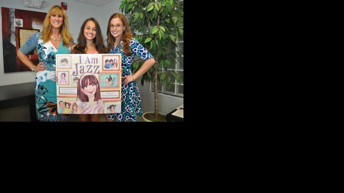 
Jazz Jennings, flanked by her mother Jeanette and Jessica Herthel, who co-wrote ‘I Am Jazz’ with the teen at a June 2014 book reading at Care Resource in Oakland Park.

