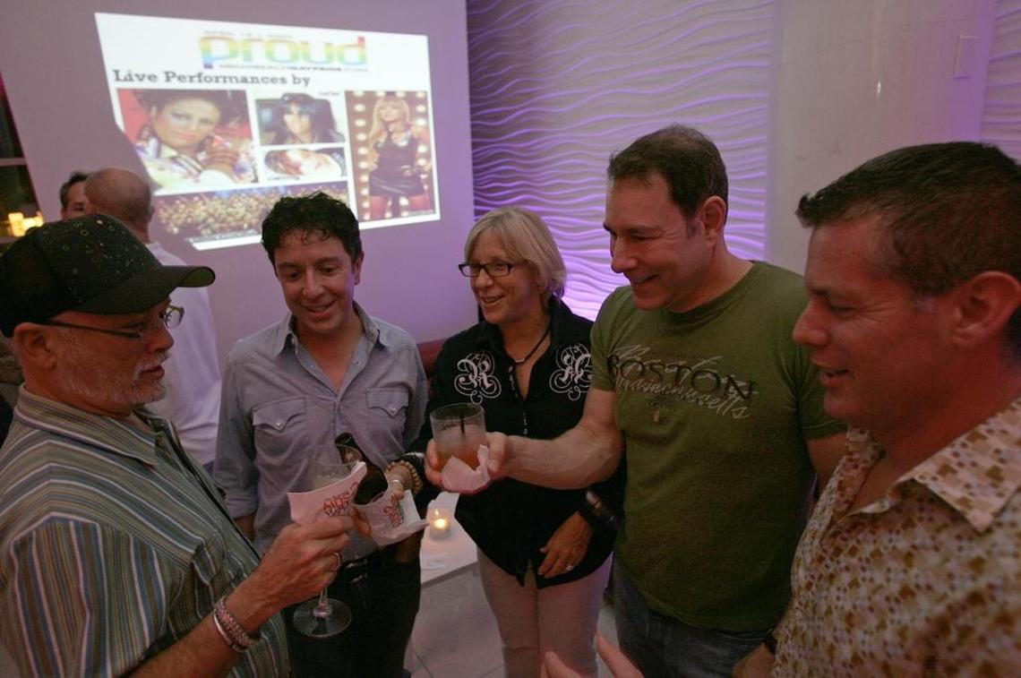 April 2009: LGBTQ activists George Neary, Rick Hanley, Cindy Brown, Larry Harmon and Russ Root, planners and coordinators of the first Miami Beach Gay Pride celebration, toast at a reception at the now-defunct Halo Lounge in Miami Beach. Expecting perhaps a few thousand attendees, more than 15,000 showed up.