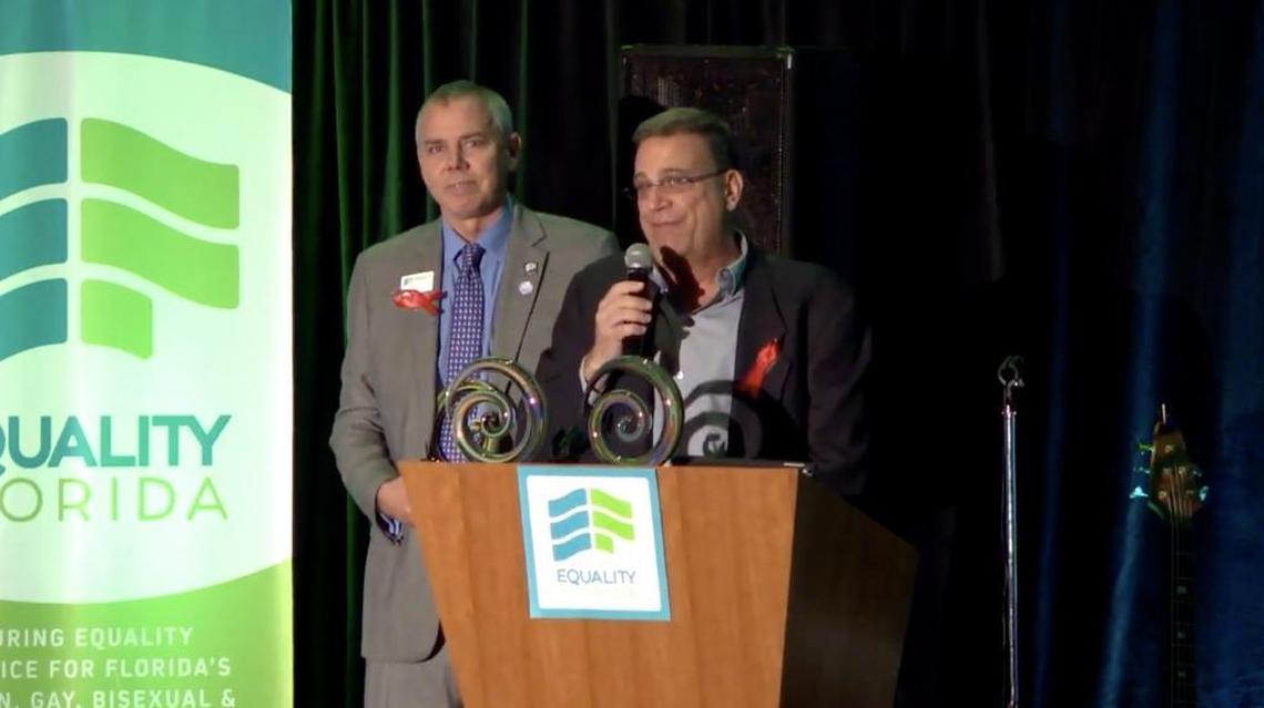 Equality Florida Deputy Director Stratton Pollitzer, left, presents H. Scott Huizenga & The Huizenga Family Foundation with Equality Florida’s Service and Leadership award.