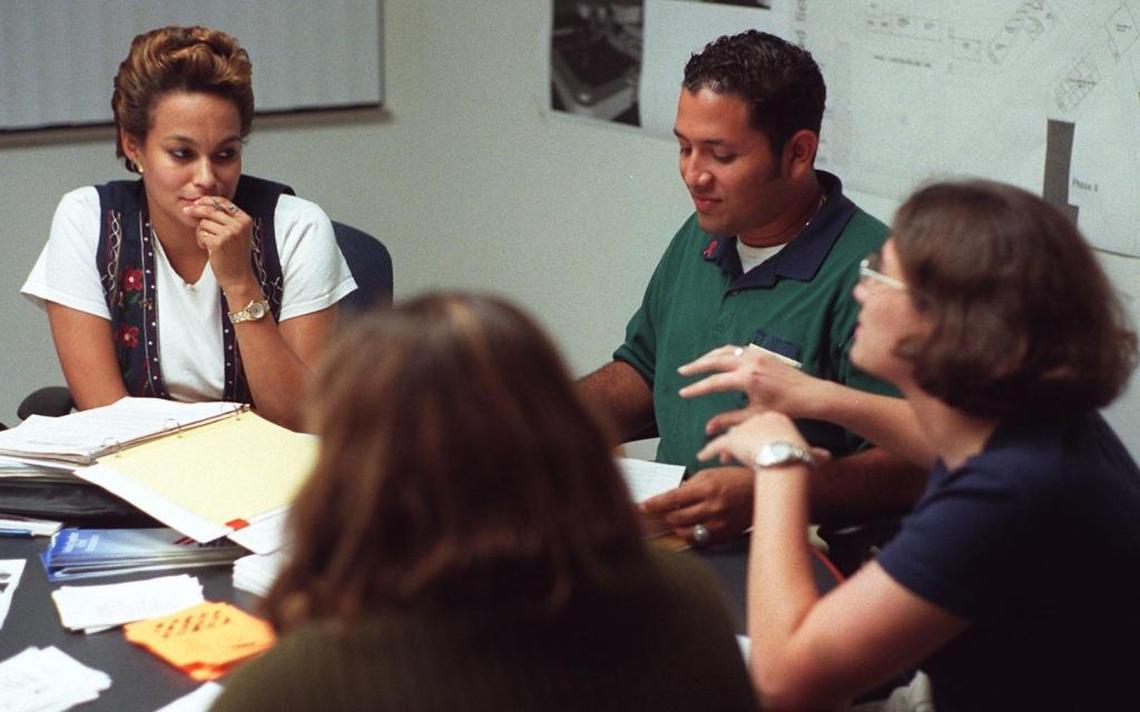 October 1998: Florida International University faculty adviser Gisela Vega, left, with Stonewall Student Union President Efrain Ayala and Cris Ascunce, during a meeting of the new gay and lesbian student group at FIU.