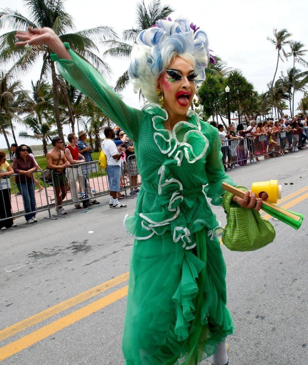 Drag queen Adora (Danilo De La Torre) acknowledges a cheering crowd in 2010 while walking in the second annual Miami Beach Gay Pride Parade.