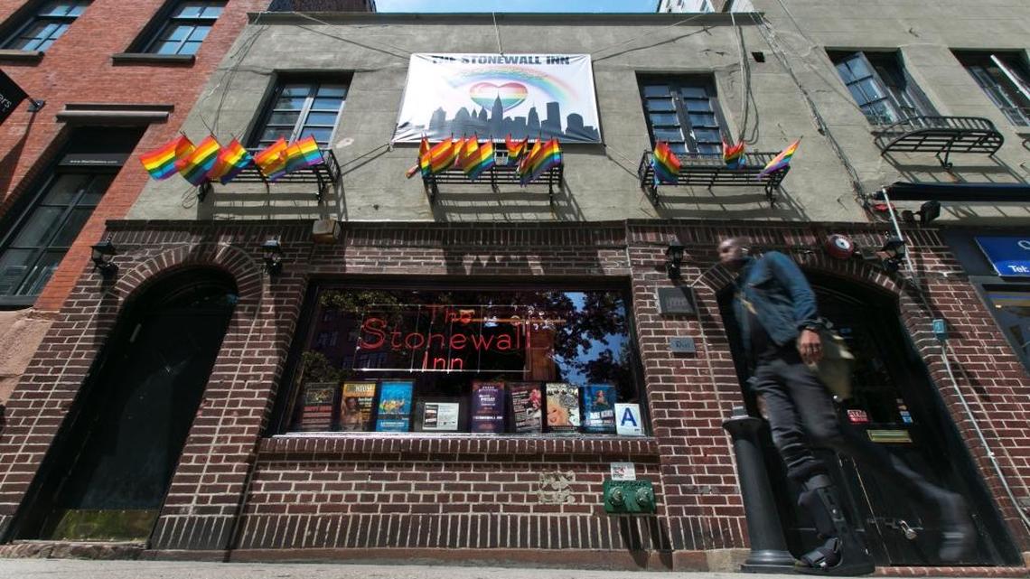 A man passes The Stonewall Inn in New York's Greenwich Village in 2014. President Barack Obama is designating the Stonewall Inn in New York a national monument, the first to honor gay rights.