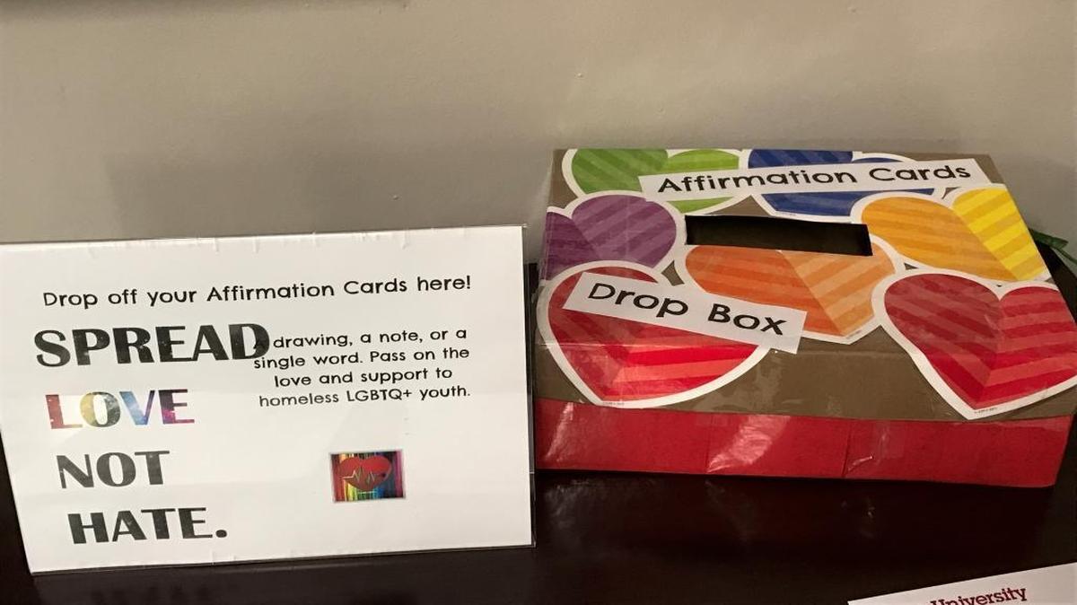 A box sitting on a table in the School of Social Work at Barry University to collect notes to give to homeless LGBT youth as part of the university’s Love Not Hate Campaign.