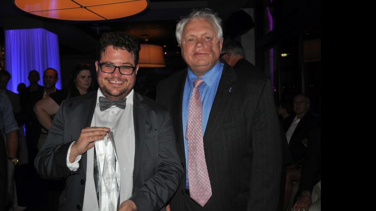 
Rodrigo Heng-Lehtinen, accompanied by his father, former U.S. Attorney Dexter Lehtinen, displays his SAVE 2015 Champions of Equality award.
