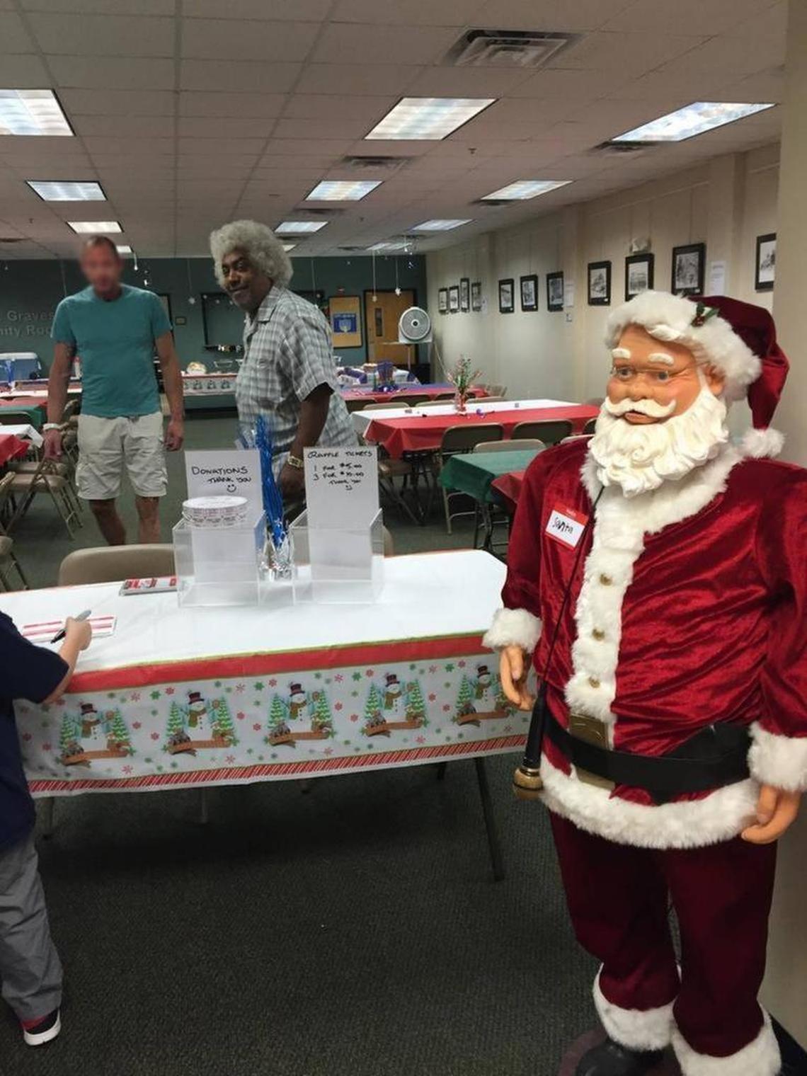This 2013 photo shows registered sex predator Clarence Collins — center, with gray hair and checkered shirt — helping set up a holiday party at The Pride Center in Wilton Manors. The son of parent Richard Alalouf, who did not know Collins’ background, plays a few feet away.