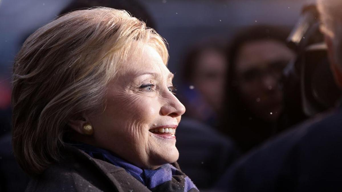 Democratic presidential candidate Hillary Clinton campaigns outside a polling place during the first-in-the-nation presidential primary, Tuesday, Feb. 9, 2016, in Manchester, New Hampshire.