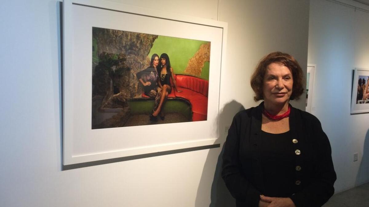 Mariette Pathy Allen poses in front of the photo she used for her book cover, ‘TransCuba.’