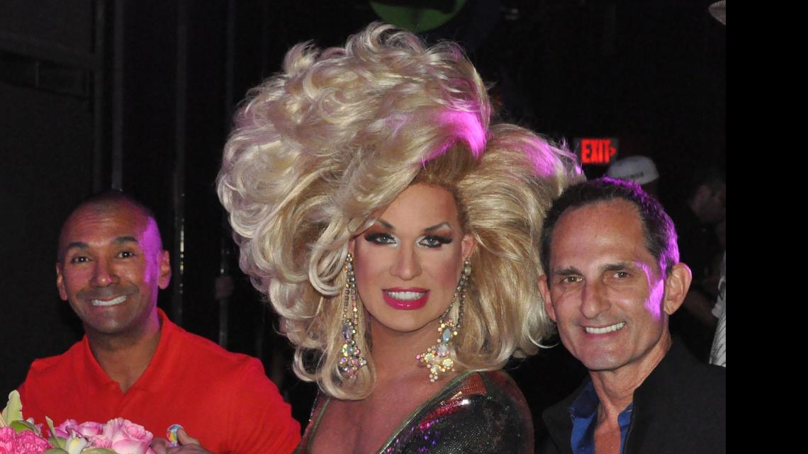 
Elaine Lancaster judges the 2015 Miss Miami Beach Gay Pride contest, flanked by Miami Beach Gay Pride Executive Director Ivan Cano and photographer Dale Stine.
