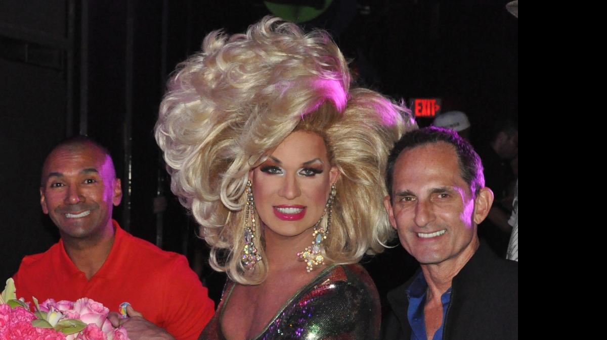 
Elaine Lancaster judges the 2015 Miss Miami Beach Gay Pride contest, flanked by Miami Beach Gay Pride Executive Director Ivan Cano and photographer Dale Stine.
