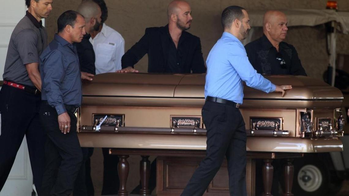 Family and friends carry the remains of one of the deceased during the funeral of Alberto Arias and Osvaldo González, partners who died in the collapse of the FIU pedestrian bridge last week.