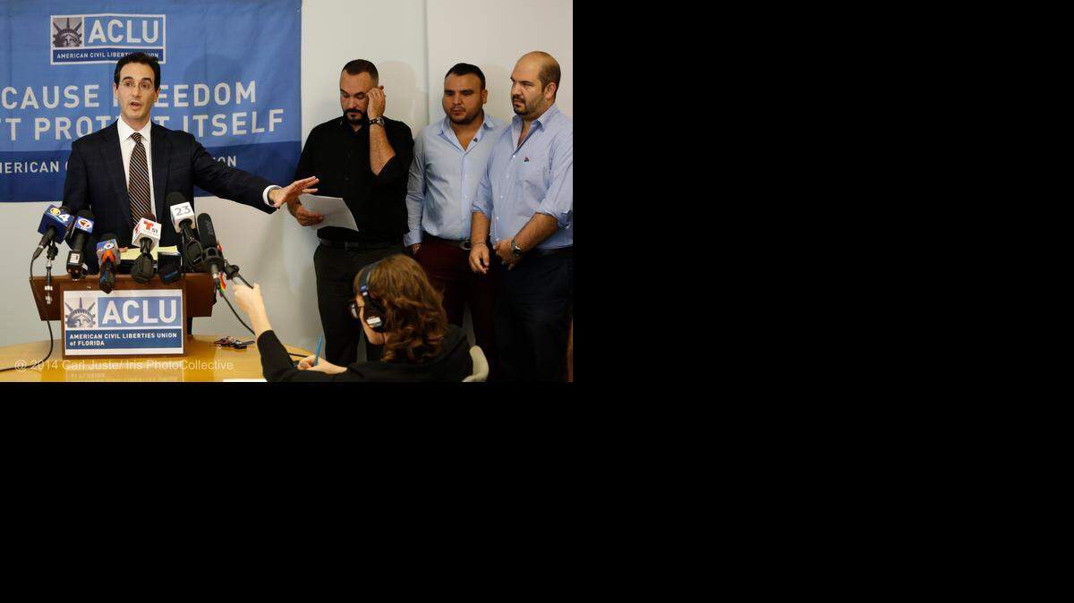 
Attorney Stephen Rosenthal, left, speaks to the media Aug. 21 after a federal court ruled that Florida’s gay marriage ban is unconstitutional. With Rosenthal are SAVE Executive Director Tony Lima and two plaintiffs in the case Carlos Andrade and husband Christian Ulvert.
