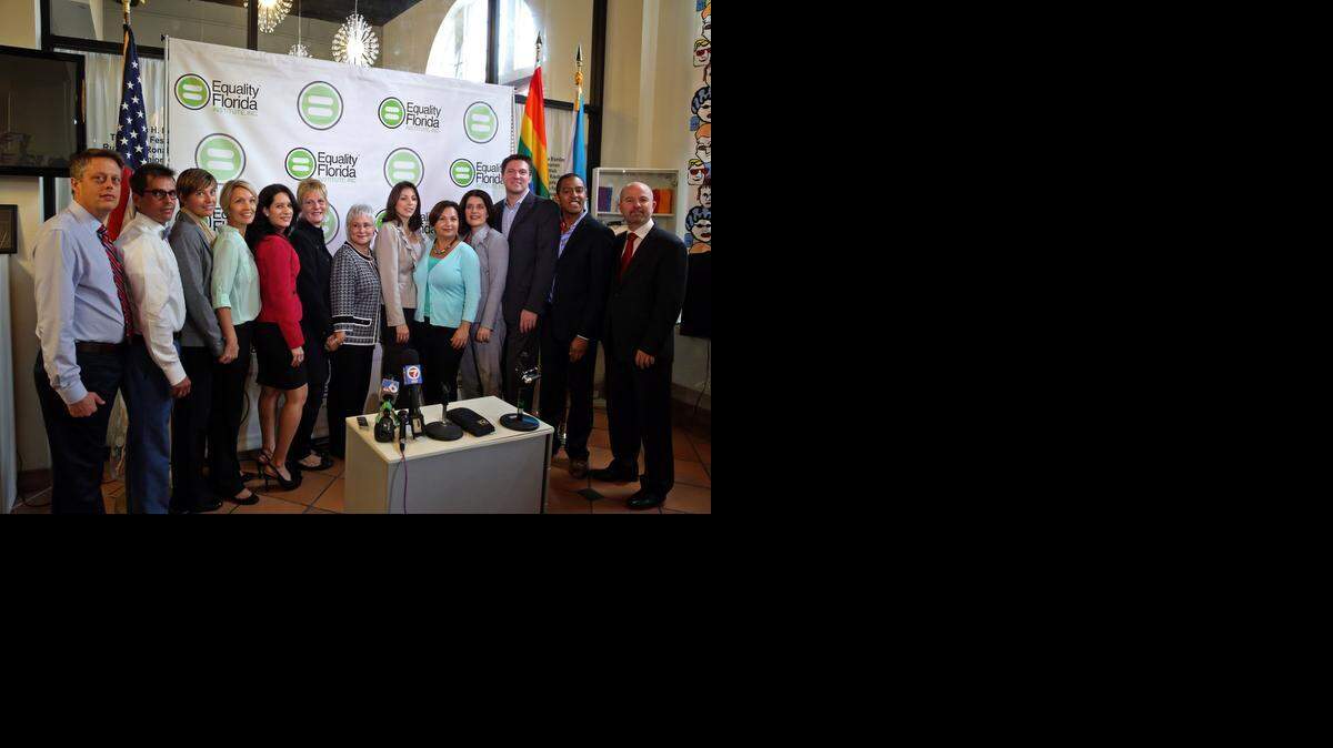 
From left: Don Price Johnston and partner, Jorge Isaias, Melanie and partner Vanessa Alenier, Attorney Cristina Alonso of Carlton Fields Jorden Burt, Pamela Faerber and partner Summer Greene, Catherine Pareto and partner Karla Arguello, attorney Elizabeth F. Schwartz, Todd and Jeff Delmay, and NCLR Legal Director Shannon Minter, after press conference announcing that six same-sex couples and Equality Florida Institute filed a lawsuit in Florida state court in Miami seeking the freedom to marry. Tuesday, Jan. 21, 2014. The announcement was made at the LGBT Visitors center on Miami Beach.
