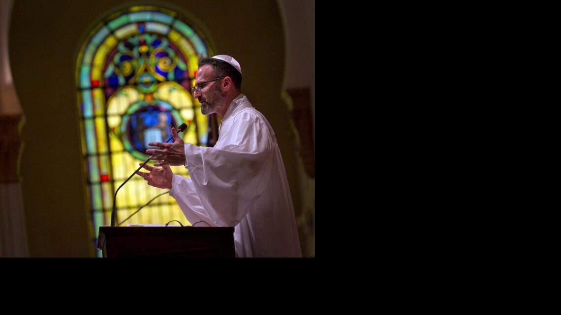 
Rabbi Tom Heyn leads the Rosh Hashana service at Temple Israel of Greater Miami in September 2014.
