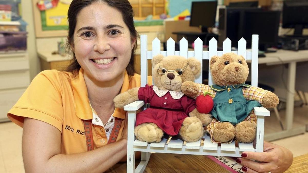 Susie Rich, a Biscayne Elementary Community School kindergarten teacher, is photographed with two of her favorite ‘co-teachers’ — Mrs. Rich and Susie Weather — on Thursday, Dec. 10, 2015, her first day back in the classroom after recuperating from her May 19 liver transplant.