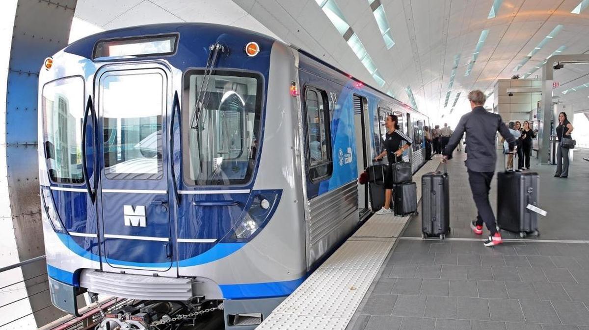 Passengers board a Metrorail train at the Miami International Airport terminal, home to the only extension track built since county voters approved a half-percent sales tax in 2002 to fund an expansion of the train system and other transit projects. The county’s transit agency is asking for another year of spending authority for consultants studying the feasibility of expanding Metrorail.
