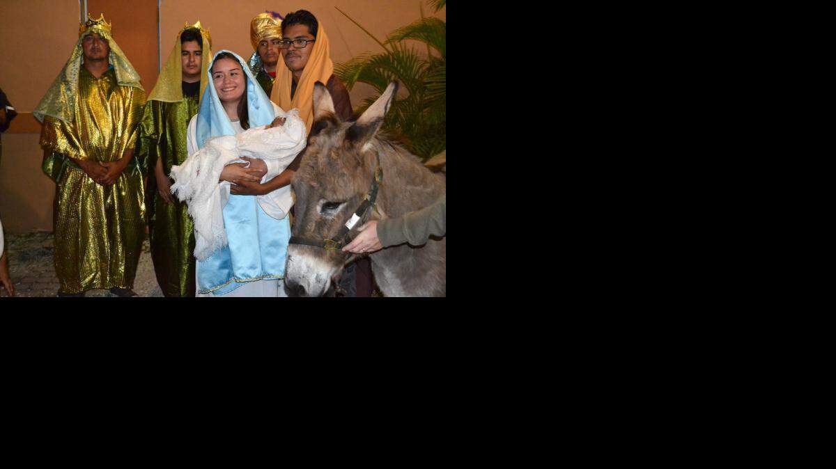 
Mexican-Americans in Homestead (and Paco, right) portray Biblical Christmas characters during street processions known as Las Posadas.
