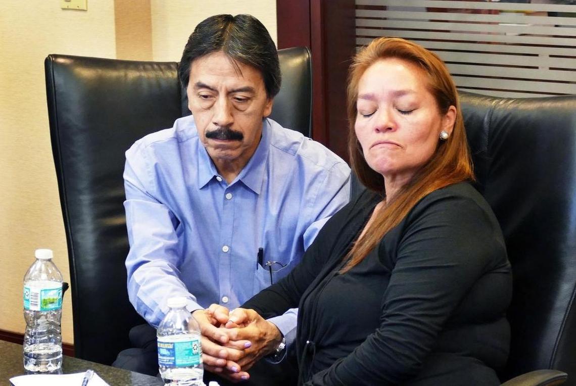 Gina and Orlando Duran, parents of Alexa Duran, a student who died when the FIU pedestrian bridge collapsed, struggle to control their emotions during a news conference announcing a lawsuit against the firms that built and designed the bridge.