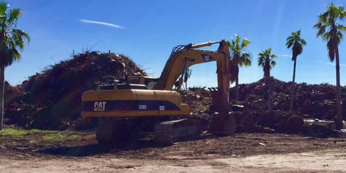Trash and debris collected after Hurricane Irma is piled high on a Virginia Key lot next to the lagoon, mountain bike trails and Virginia Key Outdoor Center.