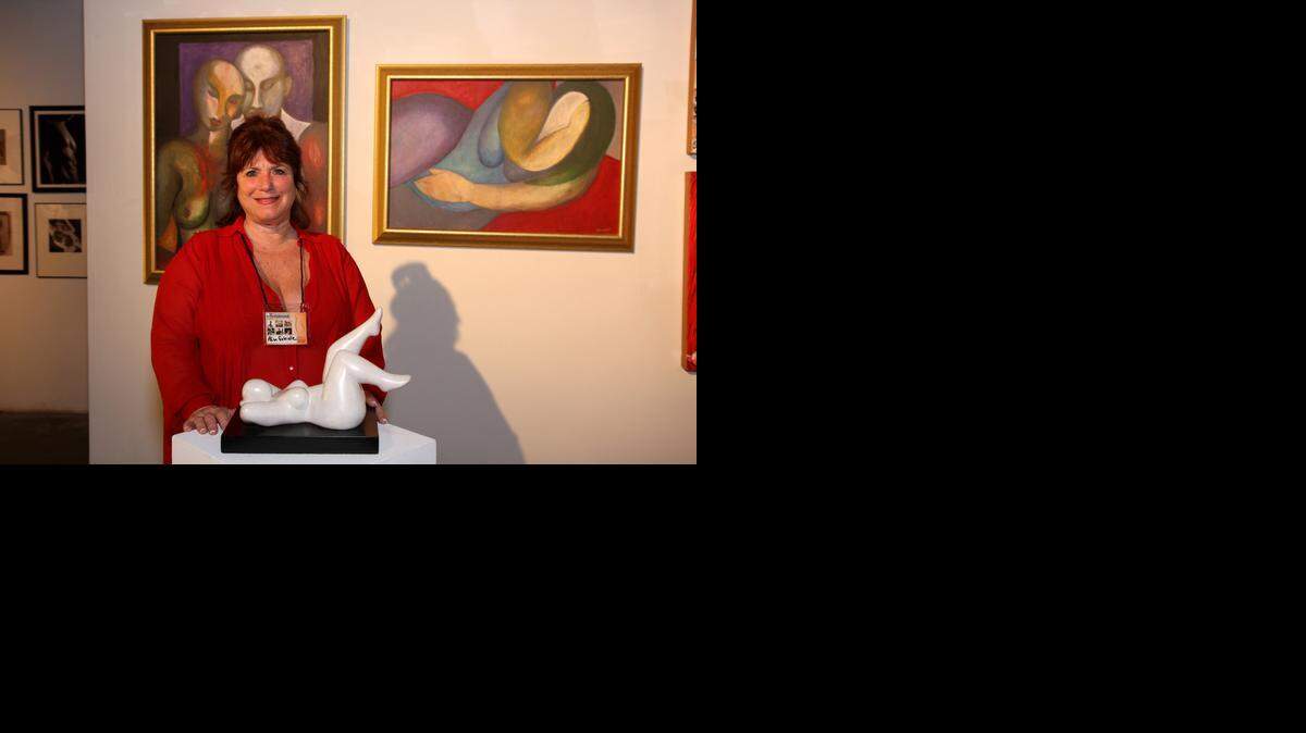 
Alisa Gabrielle poses with her sculpture entitled Cloud Nine at the 2010 ARTundressed exhibition in Los Angeles. 

