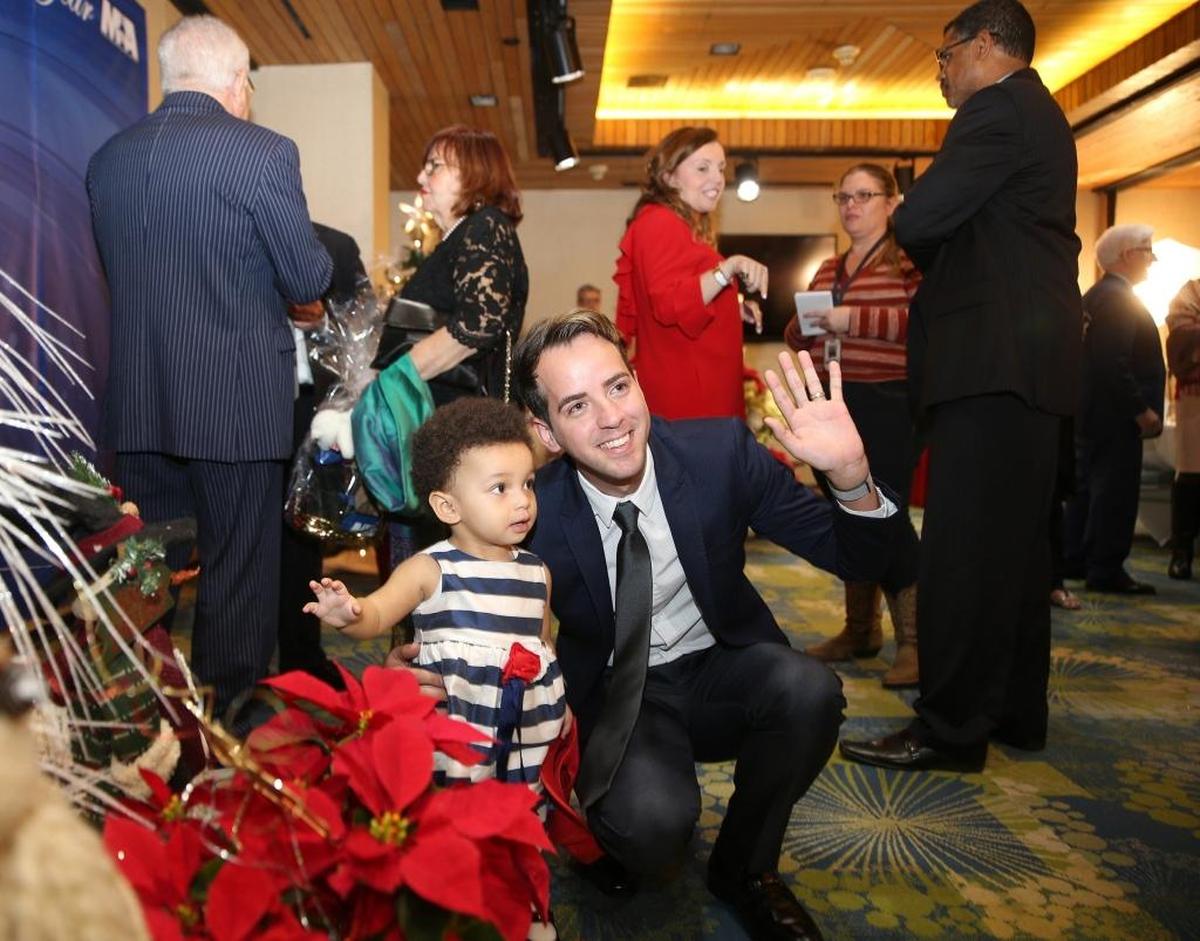 MIA Employee of the Year Jose Consuegra poses with Mia after seeing her for the first time since he resuscitated her when she stopped breathing during a stay at MIA Hotel in May.
