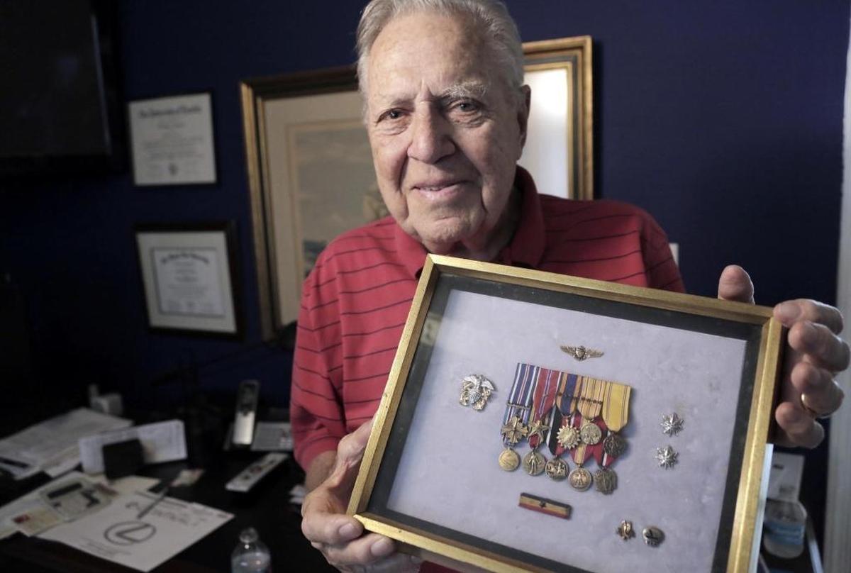 Miami, Florida, May 11, 2017- Commander Bill Gregg, a 97-year-old WWII veteran who was a pilot during the Battle of Midway, poses with ribbons and medals that have been awarded to him during his long and illustrious career.
