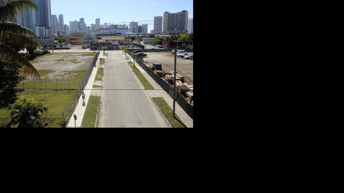 
A man runs past a vacant lot between Northeast 14th and 15th streets, just west of Northeast First Avenue in Miami, on Friday, Jan. 30, 2015. 
