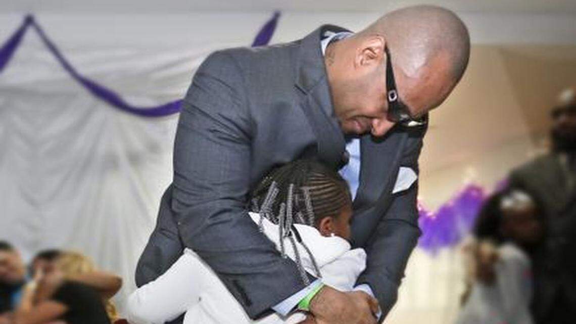 
Omar Outten dances with his daughter at the Federal Detention Center Miami during the Daddy-Daughter dance, the federal prison system's first-ever social for inmates and their daughters on Tuesday, November 4, 2014. The move is part of a broader reentry program to help prepare and encourage inmates once they leave the prison system. (Some of the faces of the subjects have been blurred to prevent identification, as agreed upon with prison authorities.)
