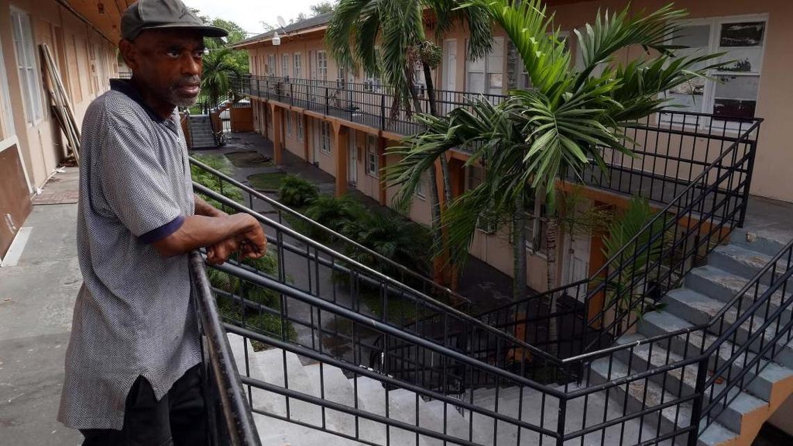 Andrew Hall looks over at South Winds, 3420 Hibiscus Street in Coconut Grove. The building has been condemned by the city of Miami.