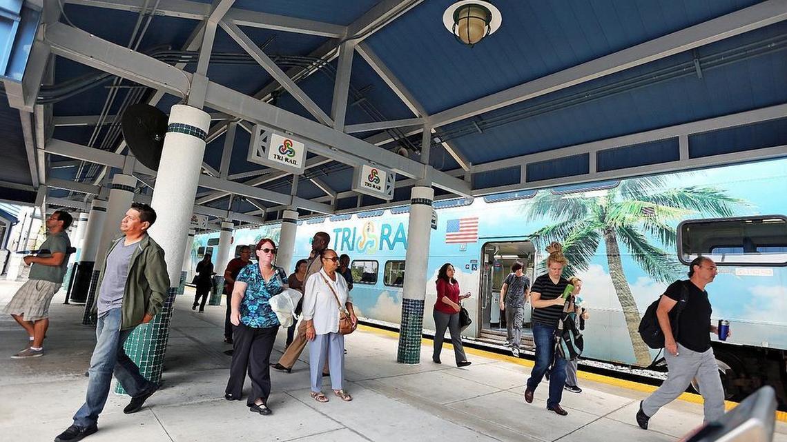 
Commuters scramble out of the Tri-Rail trains on NW 79th street in Miami on Tuesday April 21, 2015. Tri-Rail is a potential operator of an east-west commuter line that would run on tracks owned by the CSX cargo-rail company. 
