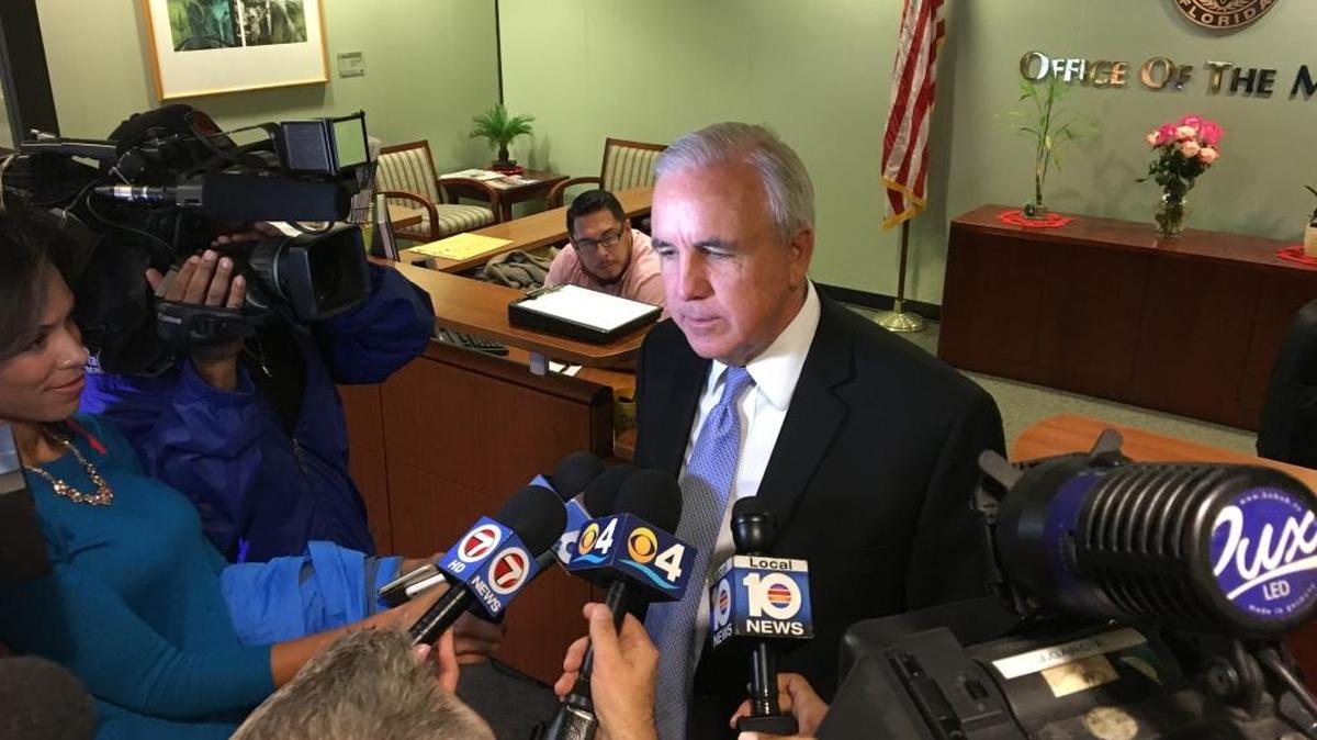 Miami-Dade Mayor Carlos Gimenez addresses reporters outside of his County Hall office in this file photo from January 2016.