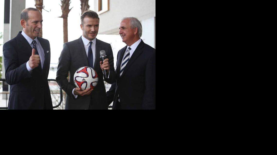 
David Beckham, (center), Major League Soccer Commissioner Don Garber (left) and Miami-Dade Mayor Carlos Gimenez hold a press conference touting the prospects of bringing professional soccer to Miami in this file photo from Feb. 5, 2014. In the months that followed, two potential stadium sites were rejected, leaving the Beckham group to continue hunting. 
