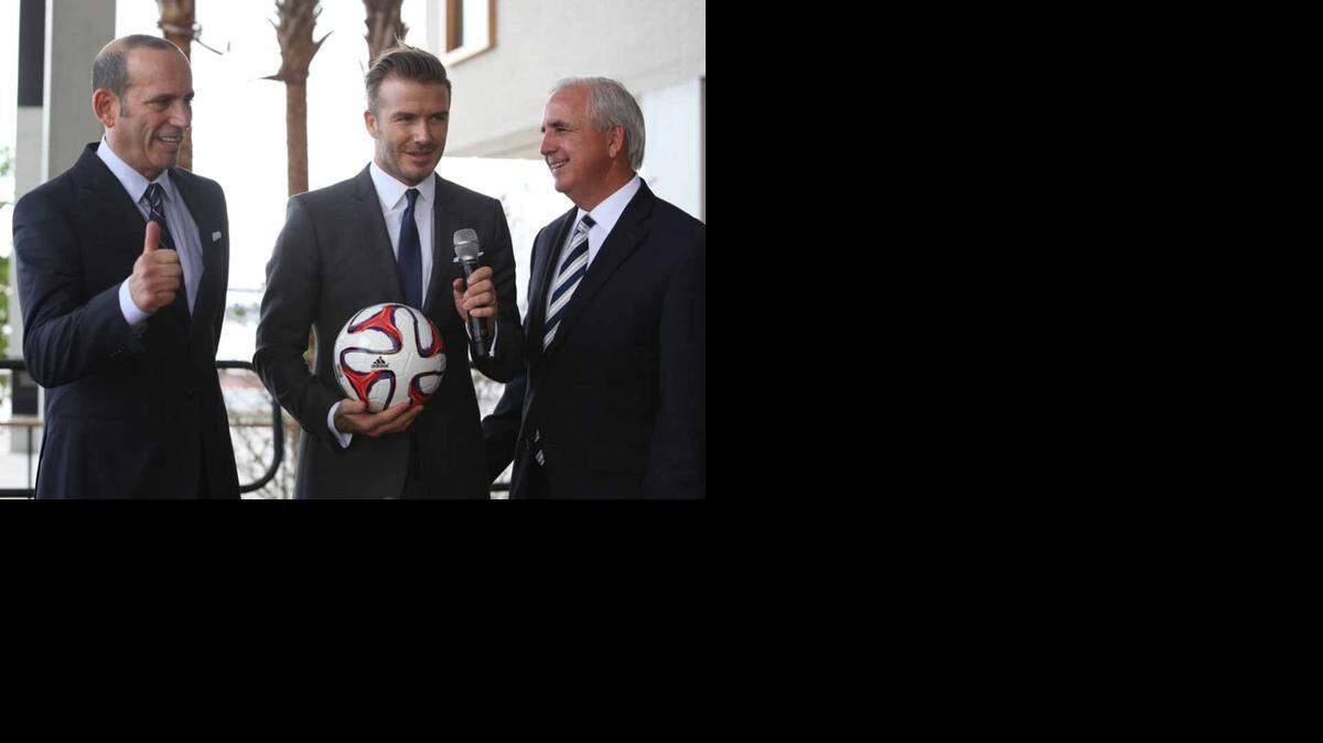 
David Beckham, (center), Major League Soccer Commissioner Don Garber (left) and Miami-Dade Mayor Carlos Gimenez hold a press conference touting the prospects of bringing professional soccer to Miami in this file photo from Feb. 5, 2014. In the months that followed, two potential stadium sites were rejected, leaving the Beckham group to continue hunting. 
