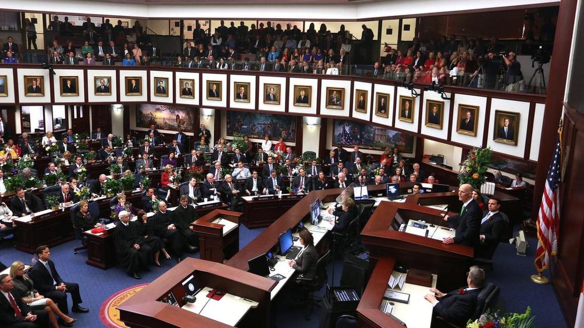 
Florida Gov. Rick Scott, right, addresses a joint session of the Florida Legislature, Tuesday, March 4, 2014 in Tallahassee.
