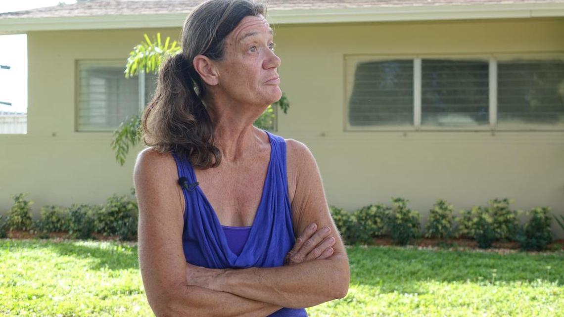Linda Cleland, 60, stands outside her Northwest Hialeah house. She was homeless for seven months after swindlers used forged quitclaim deeds to steal the home.