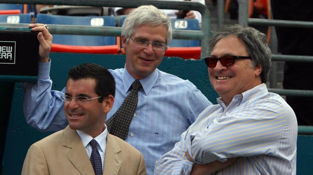 Joel Mael, center, then vice chairman of the Marlins, chats with the team’s two top executives: president David Samson, left, and owner Jeffrey Loria at the franchise’s old home at the Miami Dolphins stadium in 2008.