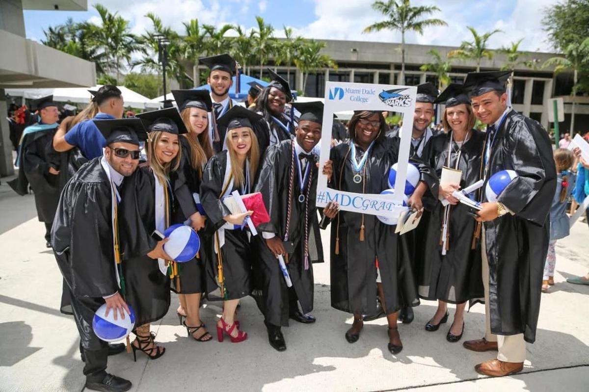 Graduates from Miami Dade College’s Homestead campus celebrate on the Kendall Campus after Ryder’s Robert E. Sanchez’s commencement speech on April 29, 2017. Gloria Jimenez, whose five daughters also attend MDC, is second from the right.