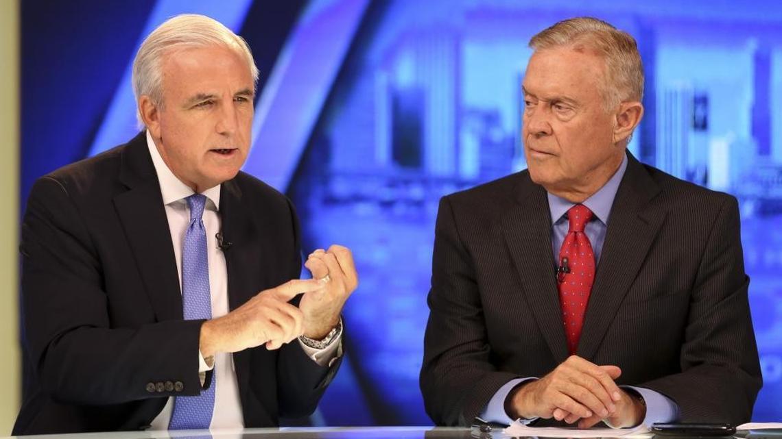 Mayor Carlos Gimenez, left, during an August appearance on “This Week in South Florida” with co-host Michael Putney in Channel 10’s WPLG studios in Hollywood on Sunday, August 14, 2016.